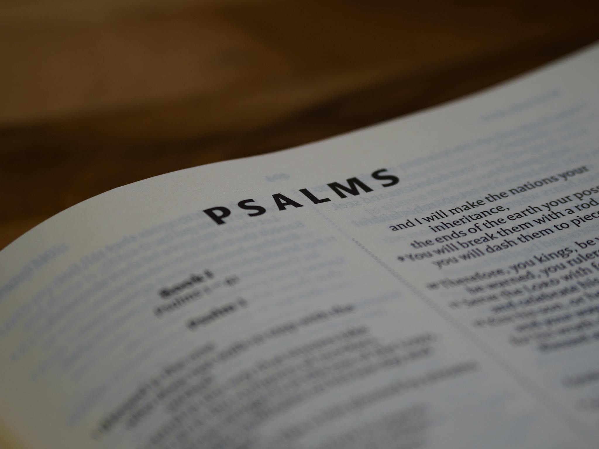A detailed close-up of a Psalms page from the Bible with text focus.